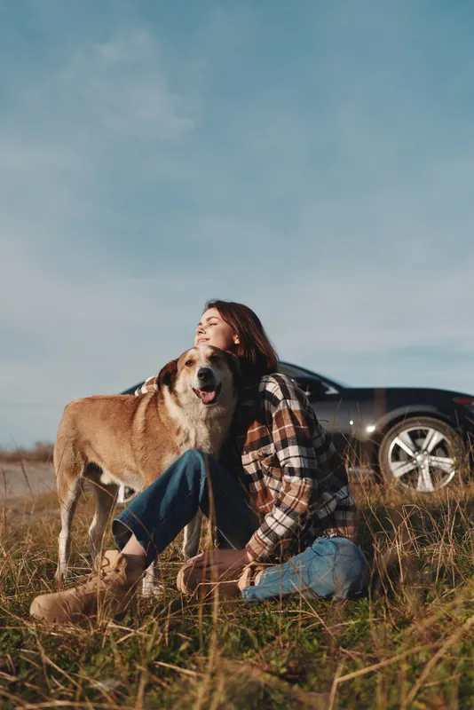 Dog, woman, outdoors, field, companionship, nature, bond, pet, animal, leisure, landscape, sunlight, grass, calm, together, moment, warmth, comfort, countryside, scenic, rural, happiness, serenity,
