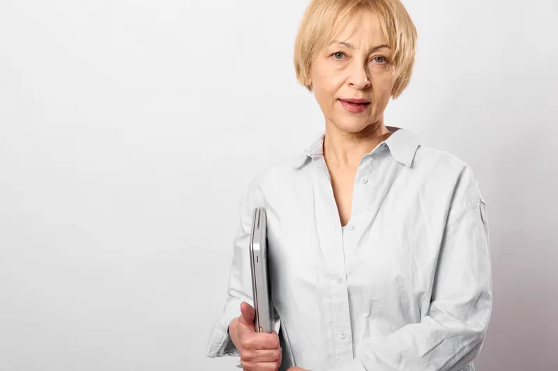 Woman, doctor, nurse, labcoat, clipboard, medical, healthcare, portrait, confident middle aged caregiver in white lab coat holding a clipboard and pen, clean studio background, medical consultation,