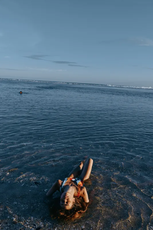 Ocean, sea, swimmer, swimming, water, horizon, sky, summer, outdoors, blue calm waves, person floats with arms raised, natural light, peaceful ocean view