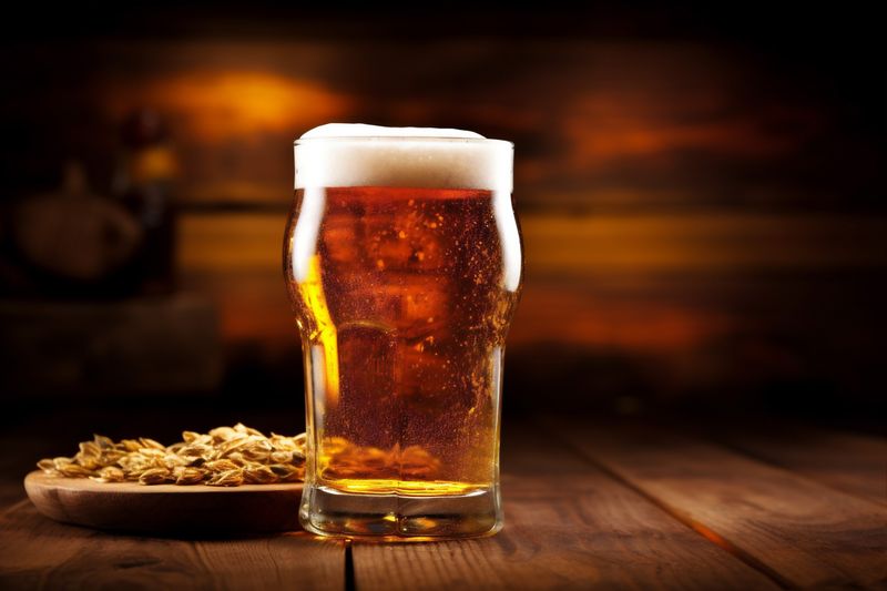 glass gold drink beer lager pint alcohol foam beverage pub. Generative AI.