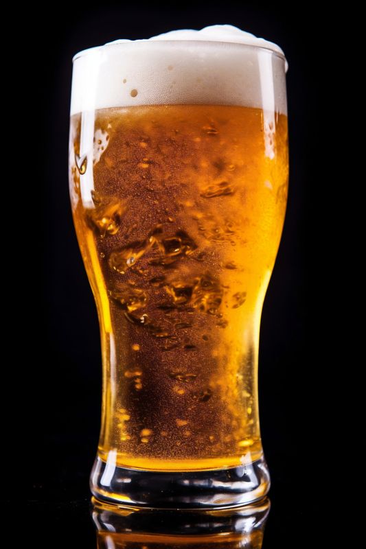 alcohol pub beverage glass gold lager drink pint beer foam. Generative AI.