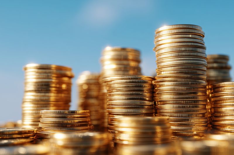 Coins gold stack money savings investment concept, financial growth and wealth accumulation with shiny currency piles economy symbol business finance idea and economic success