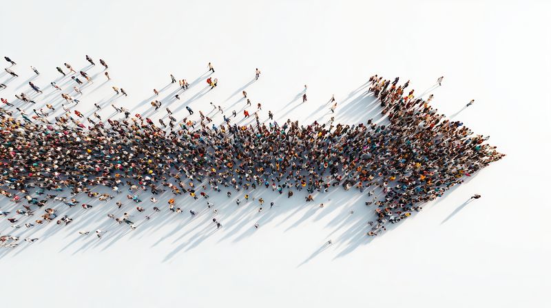Crowd arrow of people aerial top view showing direction and movement, large group formation, teamwork leadership and unity moving forward on white minimal background